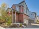 Charming two-story home with eye-catching architectural details, well-kept landscaping, and a brick driveway at 2514 Sweet Wind Ave, Castle Rock, CO 80109