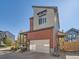Modern home exterior featuring a two-car garage and stylish architectural details at 2514 Sweet Wind Ave, Castle Rock, CO 80109