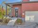 Attractive front entrance featuring a stylish black door with decorative wreath, sidelight window, and attached garage at 2514 Sweet Wind Ave, Castle Rock, CO 80109