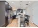 Bright kitchen with stainless steel appliances, dark cabinetry, and seating at the island at 2514 Sweet Wind Ave, Castle Rock, CO 80109