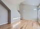 Open living room featuring hardwood floors, high ceiling, and plenty of natural light from windows and a skylight at 2514 Sweet Wind Ave, Castle Rock, CO 80109