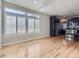 Spacious living room featuring hardwood floors, modern window shutters and abundant natural light at 2514 Sweet Wind Ave, Castle Rock, CO 80109