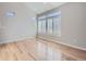 Bright, airy living room with hardwood floors, vaulted ceiling, and large windows with attractive shutters at 2514 Sweet Wind Ave, Castle Rock, CO 80109