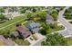 Aerial view of the property showing its manicured lawn, mature trees and location in the neighborhood at 455 Saddlewood Cir, Highlands Ranch, CO 80126
