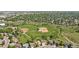 Aerial view of a neighborhood with community baseball fields and green spaces at 455 Saddlewood Cir, Highlands Ranch, CO 80126