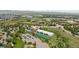 Expansive aerial view showcasing the property's proximity to the athletic club, tennis courts, and scenic surroundings at 455 Saddlewood Cir, Highlands Ranch, CO 80126