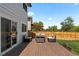 Cozy back deck featuring outdoor seating, perfect for relaxing and entertaining at 455 Saddlewood Cir, Highlands Ranch, CO 80126