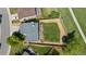 Bird's eye view of the backyard with grass, a trampoline, firepit and wood deck at 455 Saddlewood Cir, Highlands Ranch, CO 80126