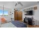 Bright bedroom with a hanging chair, closet, and desk area at 455 Saddlewood Cir, Highlands Ranch, CO 80126