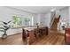 Dining room with hardwood floors, large sunny windows and a nearby staircase at 455 Saddlewood Cir, Highlands Ranch, CO 80126