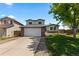 Charming two-story home with attached garage and landscaped yard at 455 Saddlewood Cir, Highlands Ranch, CO 80126