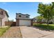 Charming two-story home with attached garage and driveway at 455 Saddlewood Cir, Highlands Ranch, CO 80126