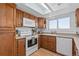 A well-lit kitchen offers ample cabinet space, modern appliances, and a view from the window at 455 Saddlewood Cir, Highlands Ranch, CO 80126