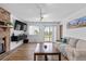 The living room offers wood floors, lots of natural light, and access to the backyard at 455 Saddlewood Cir, Highlands Ranch, CO 80126