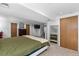 Main bedroom, featuring wood floors, walk-in closets, and an ensuite bath at 455 Saddlewood Cir, Highlands Ranch, CO 80126