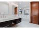 Bright bathroom with double sinks, soaking tub, and modern fixtures at 467 Saint Paul St, Denver, CO 80206