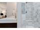 Bright bathroom featuring a walk-in shower and double sink vanity at 467 Saint Paul St, Denver, CO 80206
