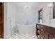 Stunning bathroom featuring a freestanding tub, modern chandelier, and marble accents at 467 Saint Paul St, Denver, CO 80206