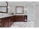 Bathroom with dual vanity, framed mirror, walk-in shower, and white tile floor at 467 Saint Paul St, Denver, CO 80206