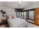 Bedroom with a private balcony, a large window, and unique decor elements at 467 Saint Paul St, Denver, CO 80206