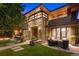 Beautiful stone home featuring an outdoor seating area and manicured lawn at 467 Saint Paul St, Denver, CO 80206