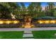 Charming home entrance featuring stone accents, lush landscaping, and walkway at 467 Saint Paul St, Denver, CO 80206