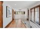 Hallway featuring hardwood floors, modern lighting, and metal railings on the staircase at 467 Saint Paul St, Denver, CO 80206