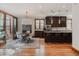 Dining area open to the kitchen with wood-look floors and plenty of room to entertain at 467 Saint Paul St, Denver, CO 80206