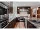 Chef's kitchen features stainless steel appliances, ample counter space, and stylish cabinetry at 467 Saint Paul St, Denver, CO 80206