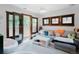 Sitting room with balcony access, stylish decor, and window shutters at 467 Saint Paul St, Denver, CO 80206