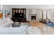 Elegant living room featuring a stone fireplace, built-in shelving, and comfortable seating at 467 Saint Paul St, Denver, CO 80206