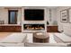 Comfortable living room featuring a modern fireplace with stone surround and plush seating at 467 Saint Paul St, Denver, CO 80206