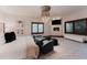 Serene primary bedroom showcasing a fireplace, sitting area, and large windows at 467 Saint Paul St, Denver, CO 80206