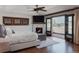 Inviting primary bedroom with private balcony, fireplace, and hardwood floors at 467 Saint Paul St, Denver, CO 80206