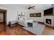 Spacious primary bedroom with a fireplace, hardwood floors, and natural light at 467 Saint Paul St, Denver, CO 80206