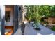 Outdoor dining area with a large table and seating surrounded by lush landscaping at 467 Saint Paul St, Denver, CO 80206