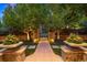 Beautiful walkway lined with trees and leading to the front gate and entrance at 467 Saint Paul St, Denver, CO 80206