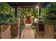 Inviting walkway leading to the front door, framed by lush greenery and stone pillars at 467 Saint Paul St, Denver, CO 80206