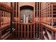 Elegant wine cellar with custom wood racking and display niche at 467 Saint Paul St, Denver, CO 80206