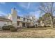 Backyard view of home featuring mature landscaping, lawn and a covered patio area at 206 S 22Nd Ave, Brighton, CO 80601