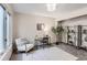 Home office with built-in shelving and a comfortable armchair at 206 S 22Nd Ave, Brighton, CO 80601