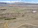 A scenic aerial view of vast open fields and distant mountains at 4226 S Eldridge St # 207, Morrison, CO 80465