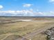 Picturesque aerial view showing the neighborhood pond and highway at 4226 S Eldridge St # 207, Morrison, CO 80465