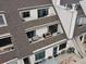 An elevated view of multiple outdoor living spaces with patio furniture and stylish roof design at 4226 S Eldridge St # 207, Morrison, CO 80465