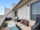 Outdoor balcony with a outdoor sofa and an accent chair at 4226 S Eldridge St # 207, Morrison, CO 80465