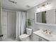 Cozy bathroom featuring a shower, toilet, sink and vanity with a mirror at 4226 S Eldridge St # 207, Morrison, CO 80465