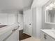 Bathroom entrance with a view of the vanity and walk in closet at 4226 S Eldridge St # 207, Morrison, CO 80465