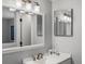 Modern bathroom featuring a sink, large mirror, vanity, and overhead lighting at 4226 S Eldridge St # 207, Morrison, CO 80465