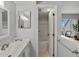 Bathroom with an open door showing the shower and a vanity with silver hardware at 4226 S Eldridge St # 207, Morrison, CO 80465