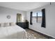Bedroom with dark wood floors, neutral walls, double bed, dresser, and natural light at 4226 S Eldridge St # 207, Morrison, CO 80465